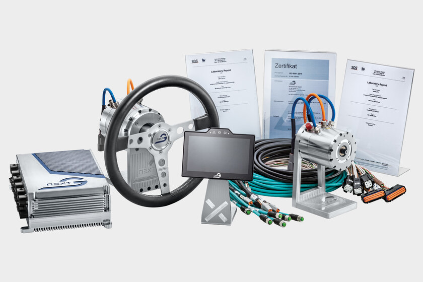 An overall picture of all NX NextMotion components, on the left the NX NextMotion, then a force feedback motor with steering wheel, a touch display, cable sets and a road switch actuator. In the background are three certificates.