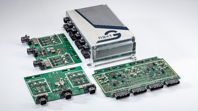 Three boards, two of which are identical and one NX NextMotion are positioned next to each other in different directions, lengthways and crossways.