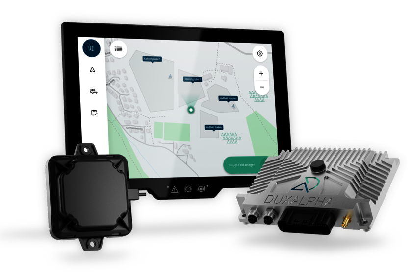 The three main components of DuxAlpha are shown in this picture. In the center rear is the large touch display with an image from the software, in the front left is a black square antenna, and on the right is the control unit with the DuxAlpha logo.