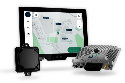 The three main components of DuxAlpha are shown in this picture. In the center rear is the large touch display with an image from the software, in the front left is a black square antenna, and on the right is the control unit with the DuxAlpha logo.