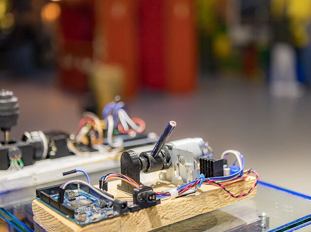In the foreground are two technical structures that formed the basis for the NX NextMotion.