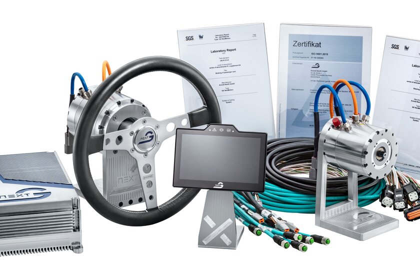 An overview of all NX NextMotion components: on the left, the NX NextMotion; then a force feedback motor with steering wheel, a touch display, cable sets, and a road wheel actuator. Three certificates are displayed in the background.